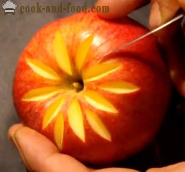 Decoratiuni de fructe pentru feluri de mâncare, tort, de masă sau sculptură dintr-un măr cu o fotografie, video